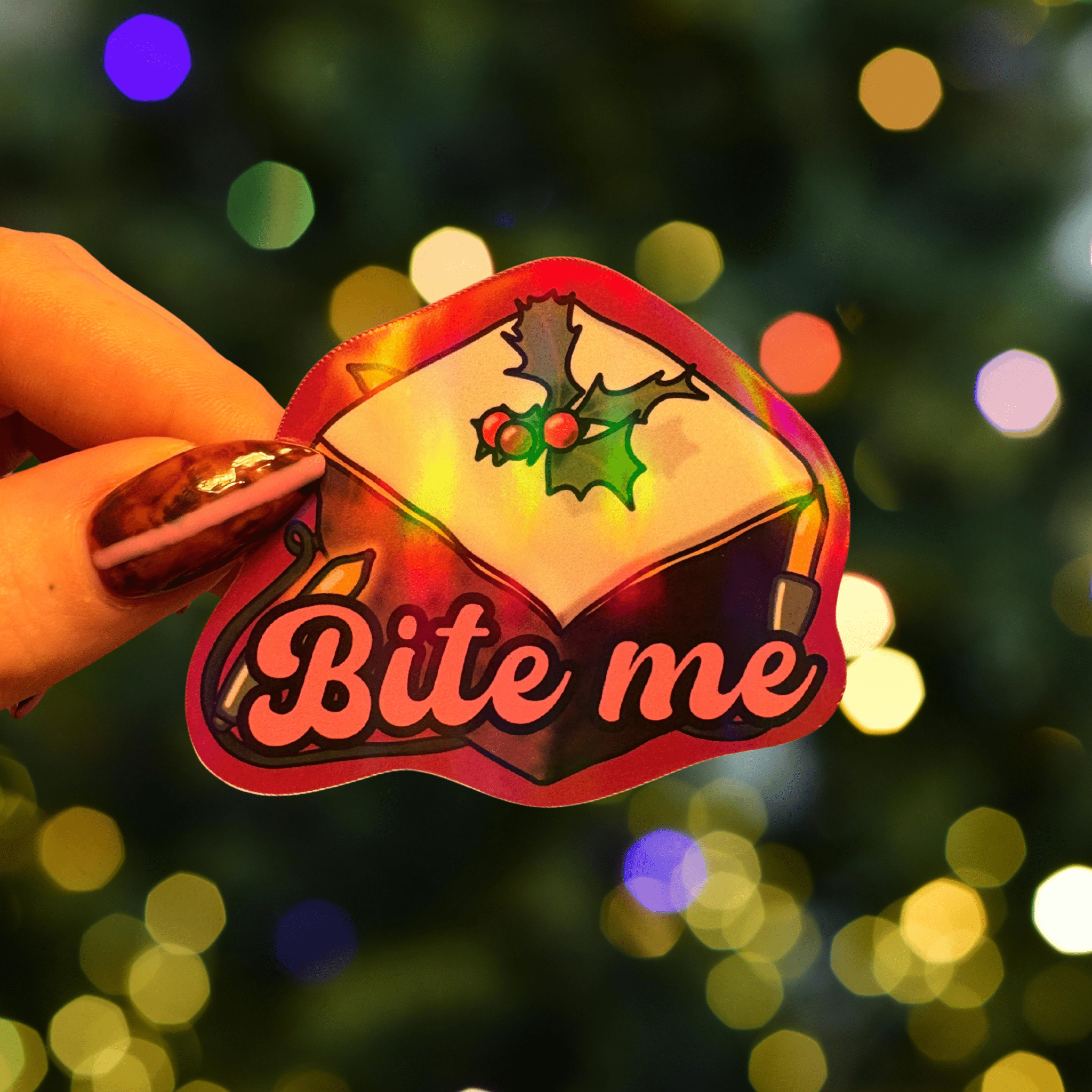 Bite me holographic Christmas stickerThe Offensive Sticker Co.